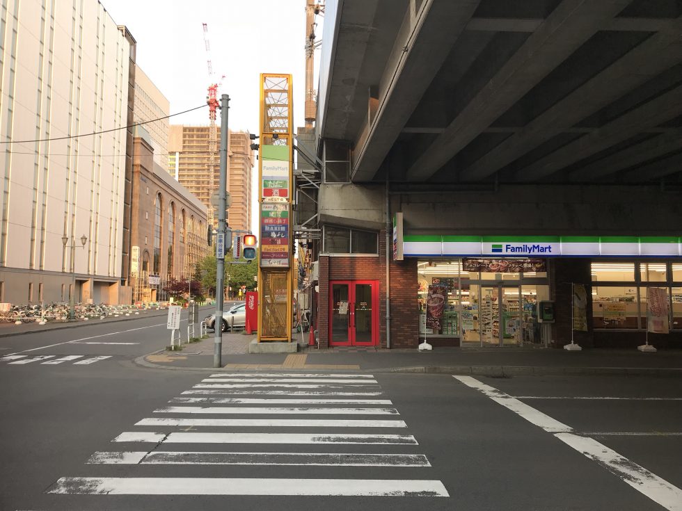 7. Cross this road and walk through the red doors into the next corridor.